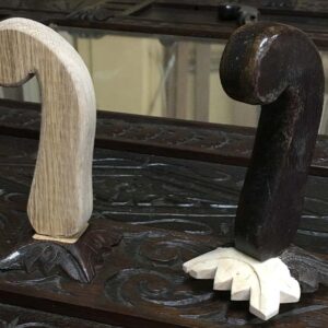 Handcrafted wooden bar tap handles carved from solid wood with natural and dark finishes.