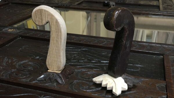 Handcrafted wooden bar tap handles carved from solid wood with natural and dark finishes.