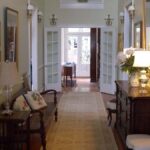 Classic built-in hallway cabinet with dark wood finish and concealed storage.