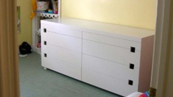 Handcrafted Built-In Drawer Storage Cabinet Handcrafted built-in drawer storage cabinet with white finish, integrated drawers, and clean minimalist design for a residential interior.