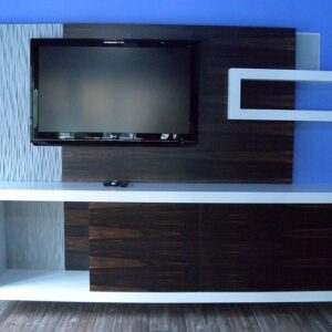 Handcrafted modern built-in entertainment center with high-contrast materials and integrated display.