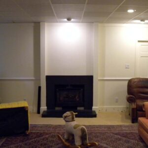 Handcrafted built-in fireplace surround with clean architectural design.