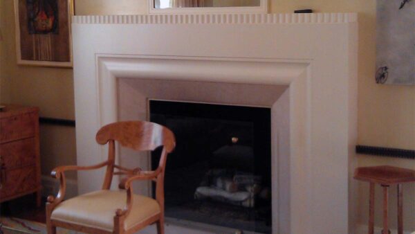 Handcrafted clean-line fireplace surround with painted finish and architectural proportions.