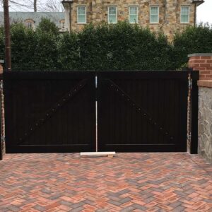 Custom wooden exterior gate with symmetrical design and dark wood finish.
