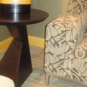 Handcrafted sculptural lamp stand with solid wood construction and dark finish.