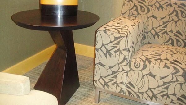 Handcrafted sculptural lamp stand with solid wood construction and dark finish.