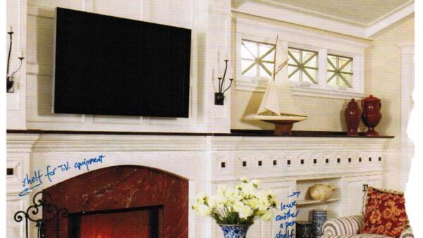 Handcrafted Fireplace Mantel with Integrated Media Wall Handcrafted white fireplace mantel with integrated media wall, built-in open shelving, extended mantel shelf, and wall-mounted TV in a living room.