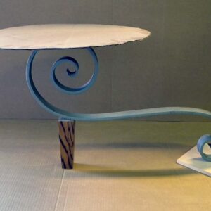 Handcrafted sculptural accent table with a freestanding configuration, organic flowing base, and minimalist tabletop designed for a modern living room.