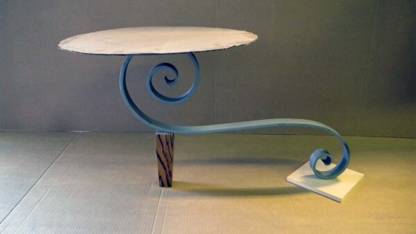 Handcrafted sculptural accent table with a freestanding configuration, organic flowing base, and minimalist tabletop designed for a modern living room.