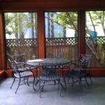 Custom outdoor living pavilion with solid wood structure and covered seating area.