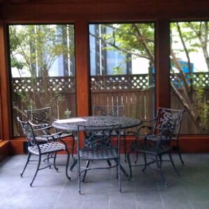 Custom outdoor living pavilion with solid wood structure and covered seating area.