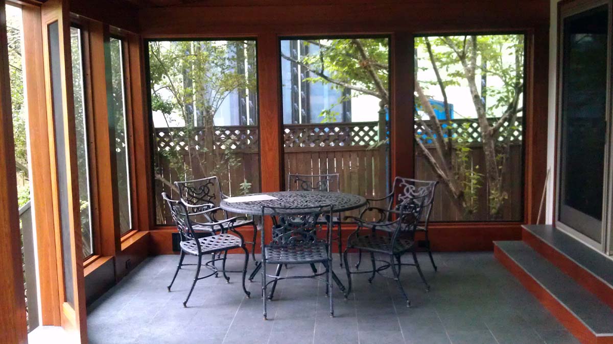 Custom outdoor living pavilion with solid wood structure and covered seating area.