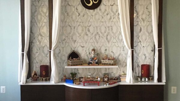 Built-in decorative shrine cabinet with symmetrical design and display area.